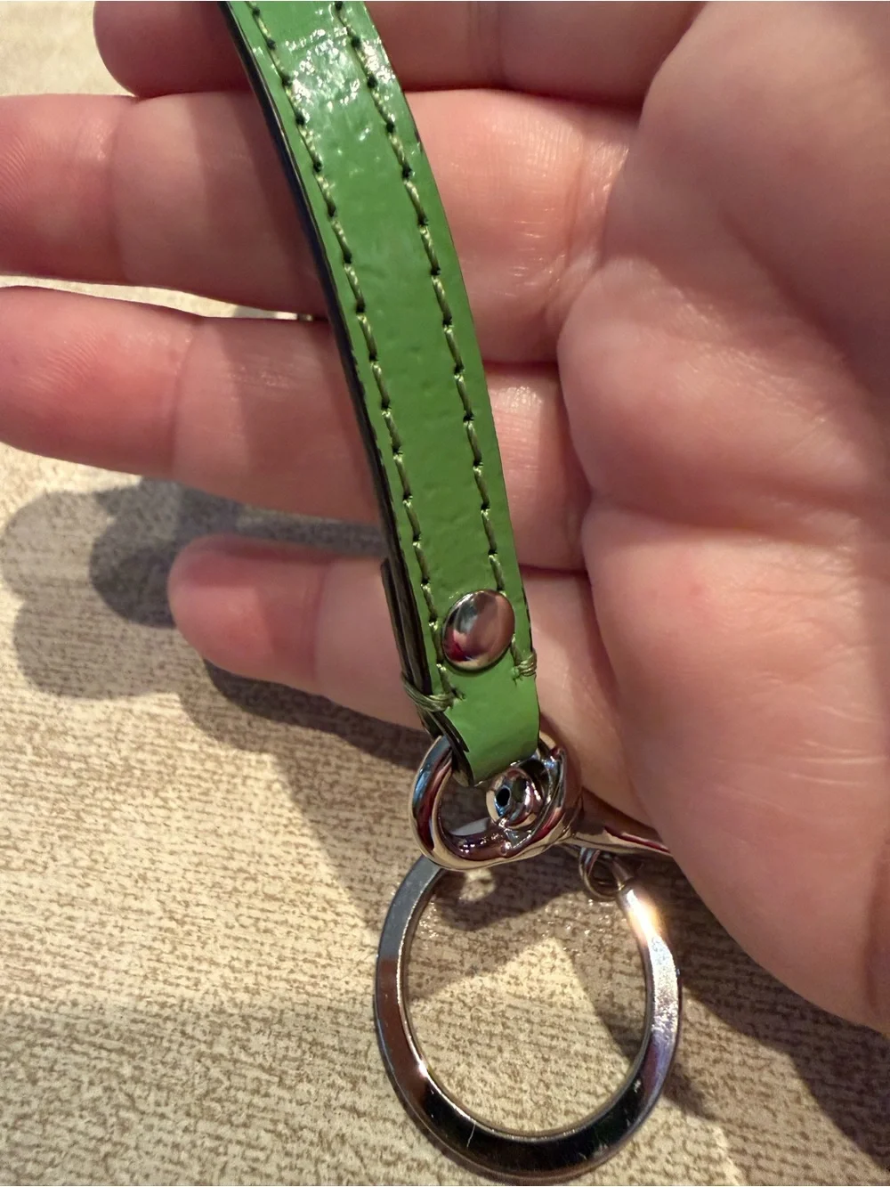 Coach Brown Signature Wristlet with Green Trim and Daisy Motif